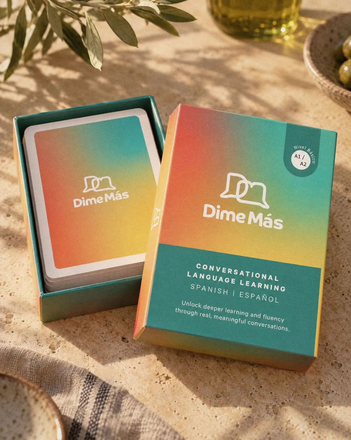 An open Dime Más Cards box, Beginner A1/A2, in warm daylight.
